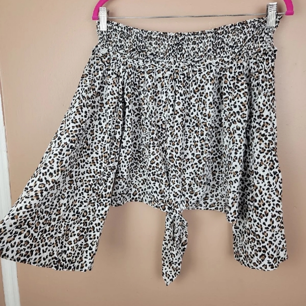 Free people movement biege and black cheetah print off Shoulder blouse